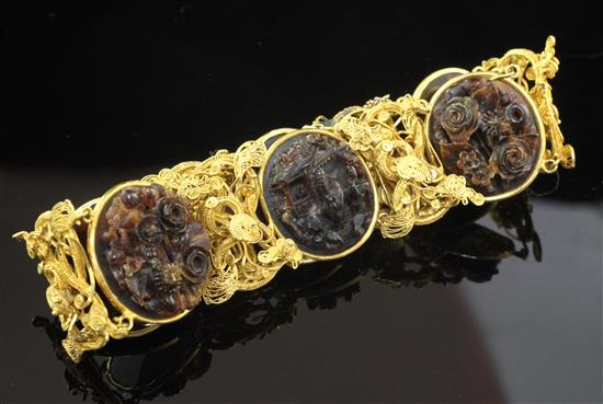 An early 20th century Chinese high carat gold filigree and tortoiseshell bracelet, gross weight 27 grams.